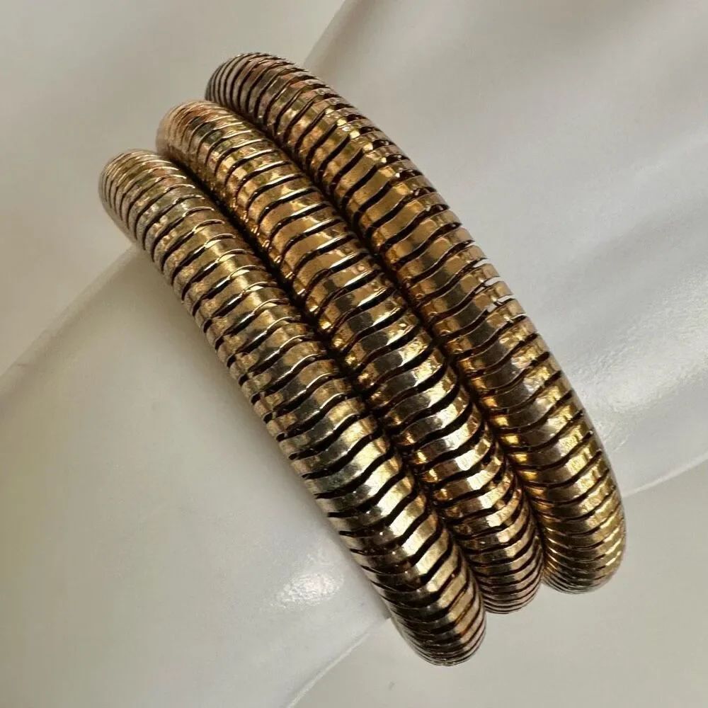 Gold tone triple strand bracelet